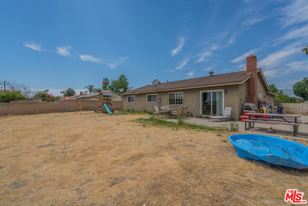 983 East Margarita Road Rialto, CA 92376 - Photo 23 of 23 a view of a house with backyard and sitting area