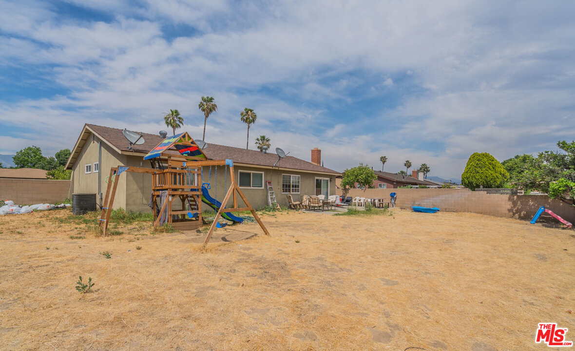 983 East Margarita Road Rialto, CA 92376 - Photo 4 of 23 a front view of a house with a yard