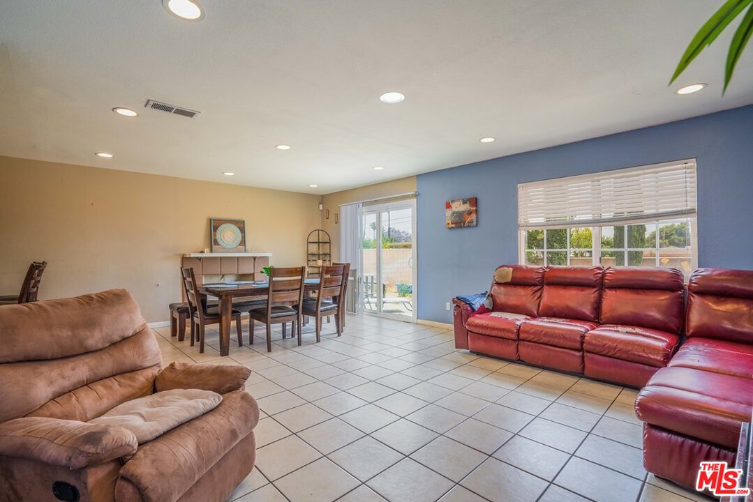 983 East Margarita Road Rialto, CA 92376 - Photo 5 of 23 a living room with furniture and a large window