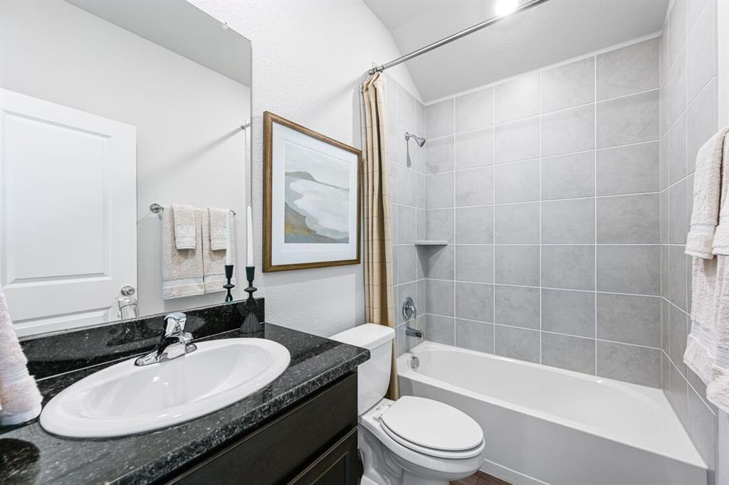 2621 Glacier Road Anna, TX 75409 - Photo 4 of 38 a bathroom with a granite countertop sink mirror toilet and bathtub