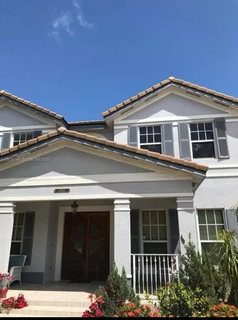 a front view of a house with garage