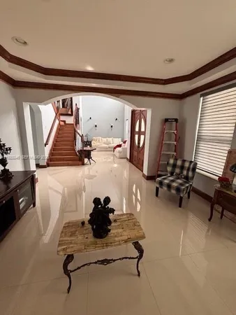 a room with gym equipment and a large window