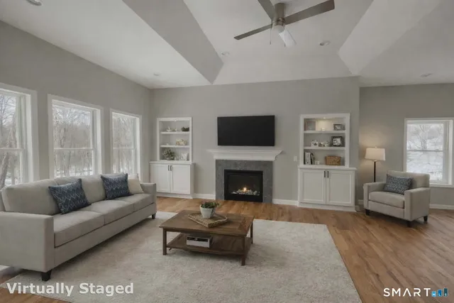a living room with furniture and a fireplace