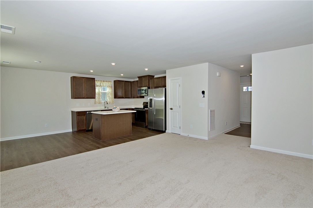 723 Peridot Way Westminster, SC 29693 - Photo 16 of 45 An open-concept living space with a contemporary kitchen and a welcoming entrance.