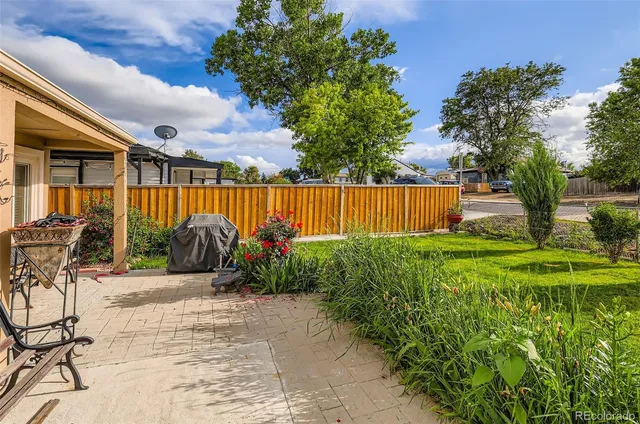 a view of a chair and table in the patio
