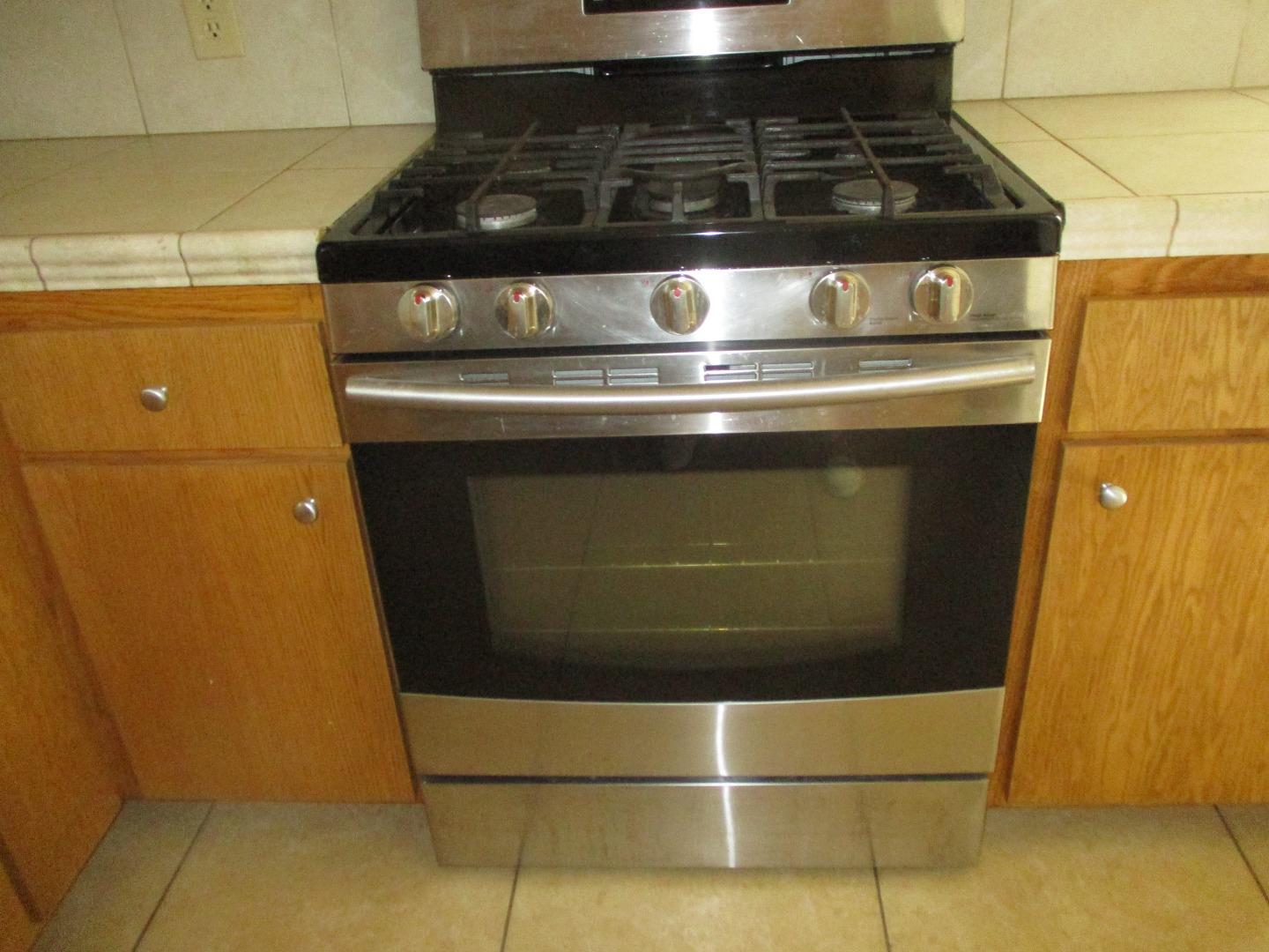 Murray Avenue Gilroy, CA 95020 - Photo 13 of 25 a stove top oven sitting inside of a kitchen