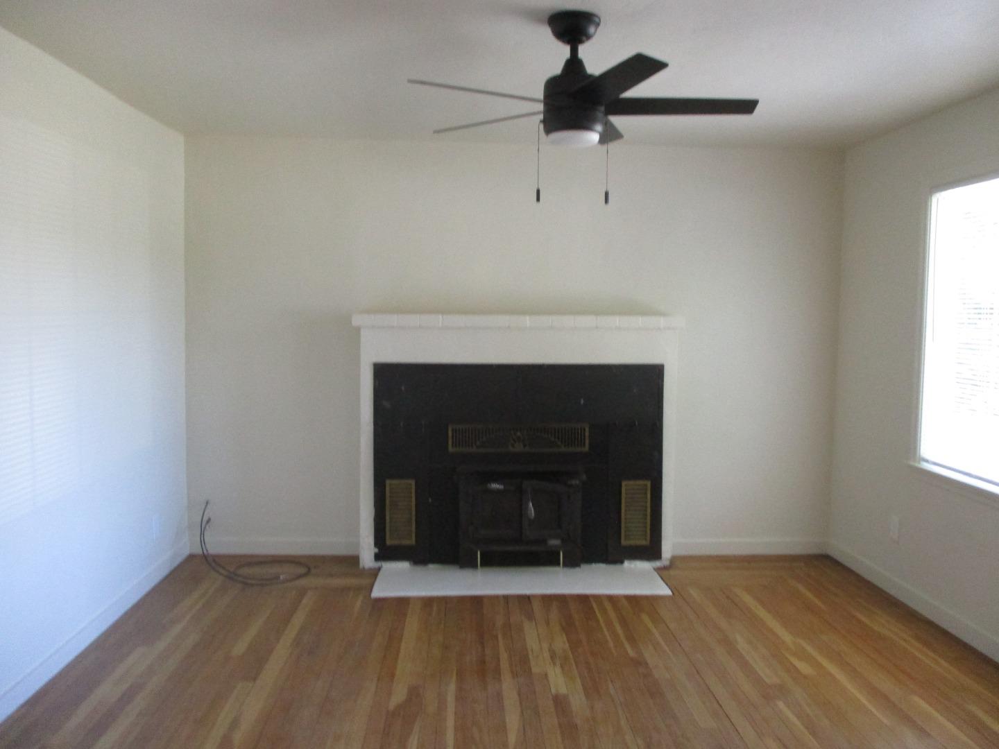 Murray Avenue Gilroy, CA 95020 - Photo 4 of 25 wooden floor fireplace and window in an empty room