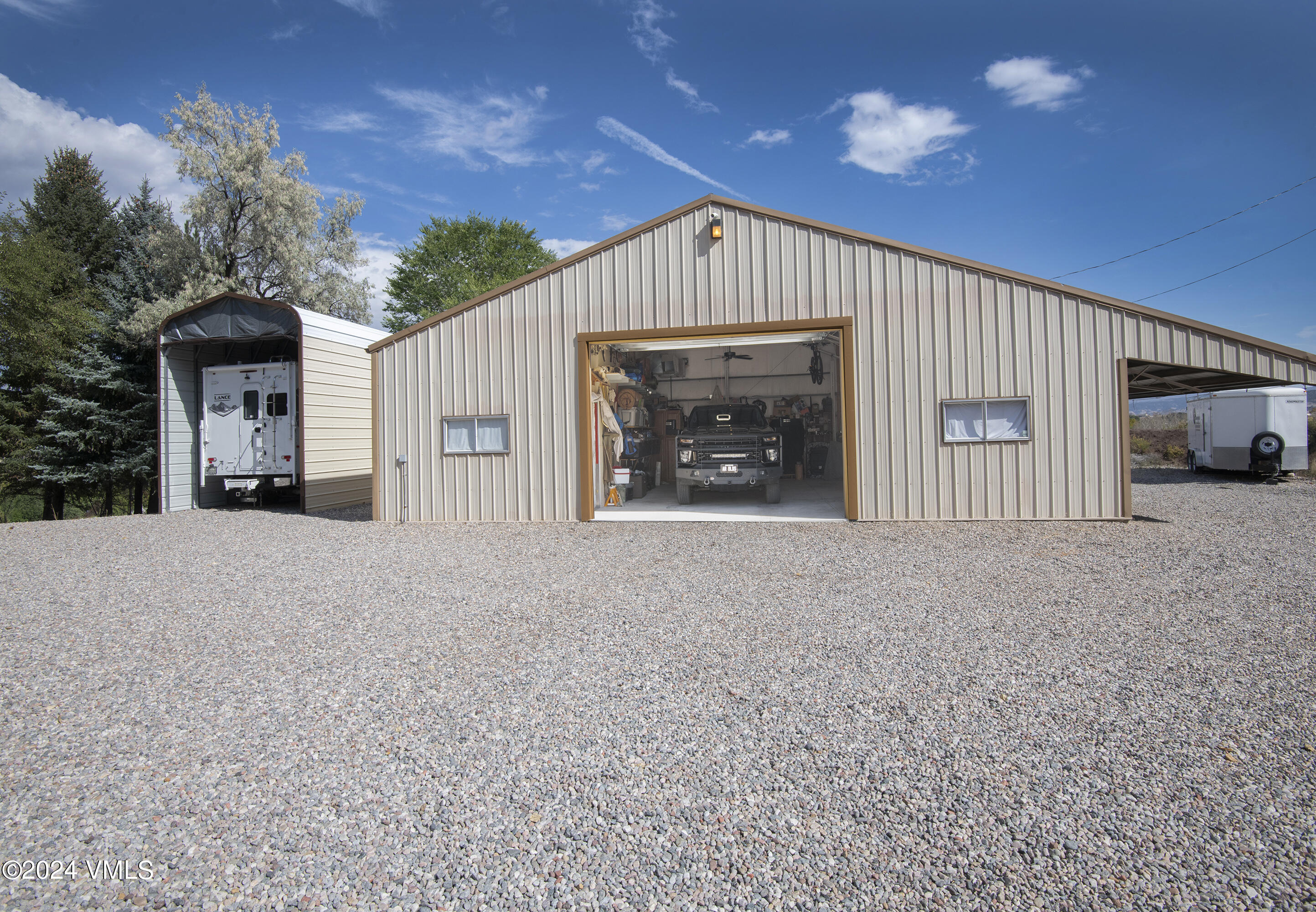 220 Beacon Road Gypsum, CO 81637 - Photo 11 of 12 a view of a house with a yard and garage