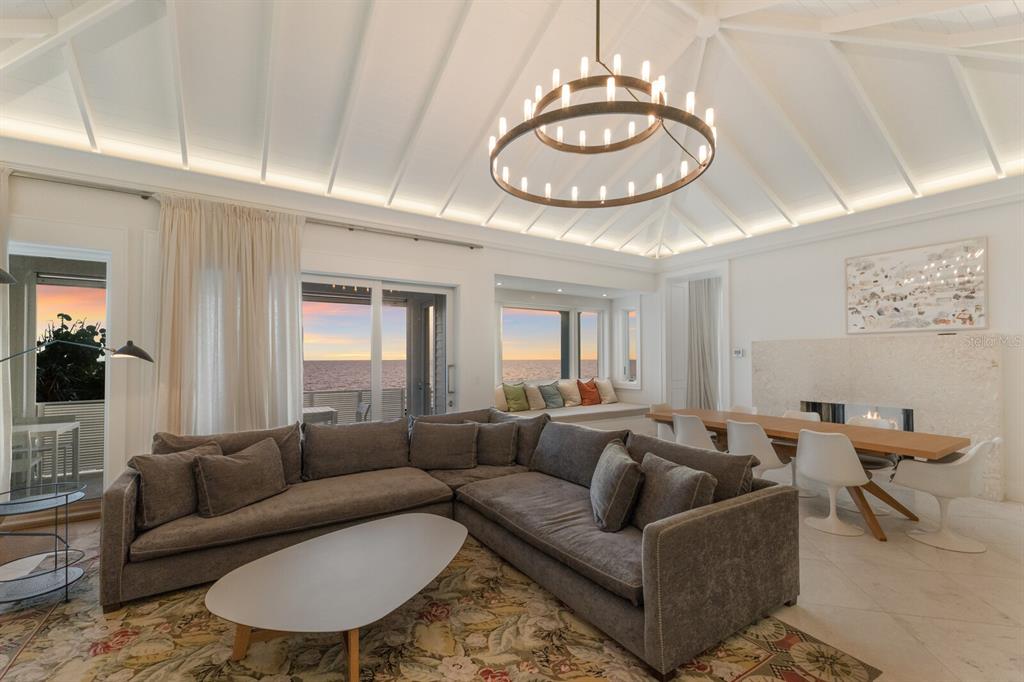 2031 Shore Lane Boca Grande, FL 33921 - Photo 14 of 100 a living room with furniture a large window and a chandelier