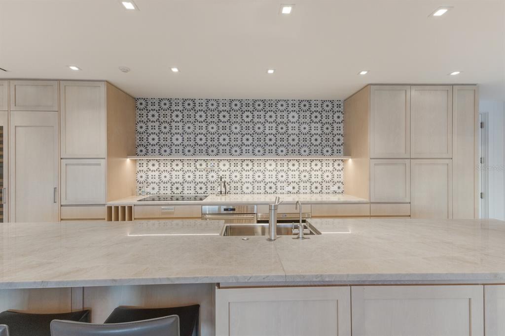 2031 Shore Lane Boca Grande, FL 33921 - Photo 20 of 100 a kitchen with a sink and a white cabinets