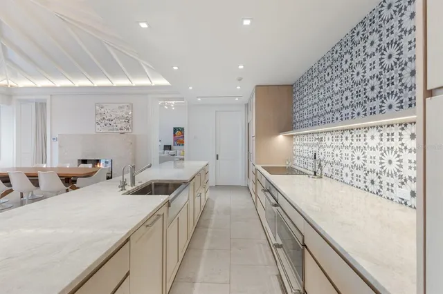 a living room with furniture a flat screen tv and a window