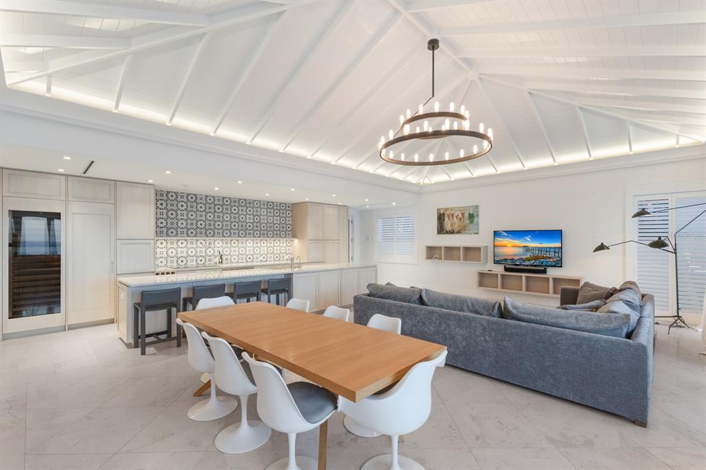 2031 Shore Lane Boca Grande, FL 33921 - Photo 24 of 100 a living room with stainless steel appliances kitchen island a table and chairs