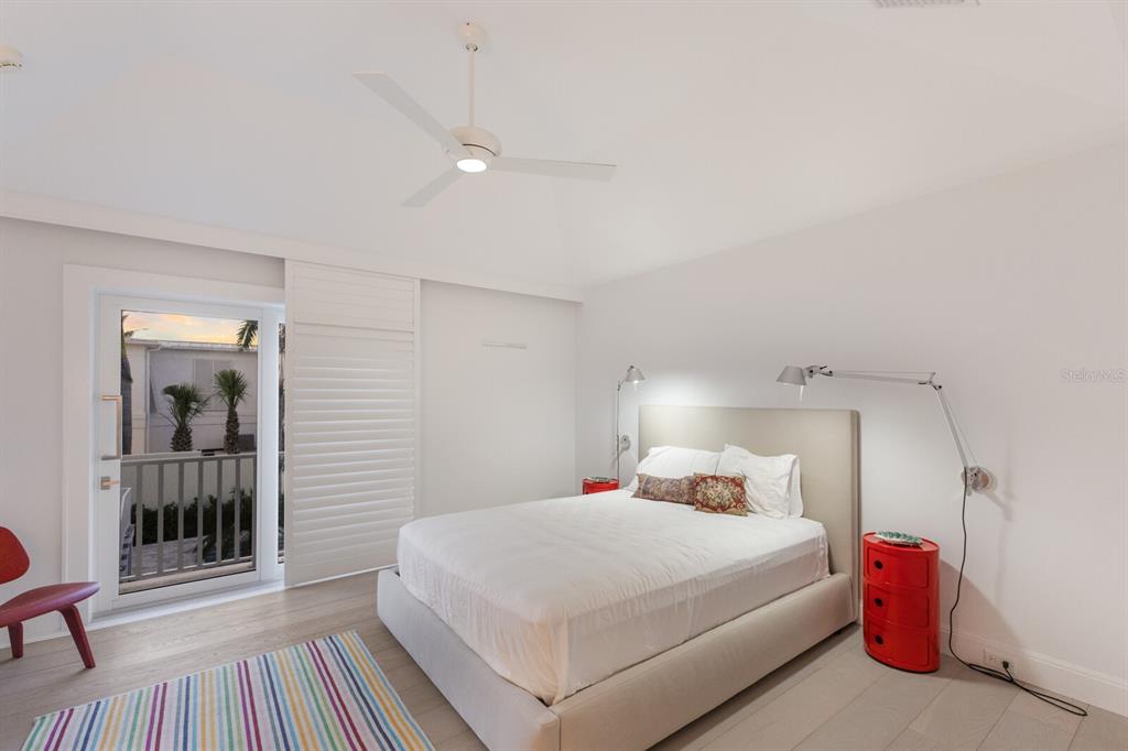 2031 Shore Lane Boca Grande, FL 33921 - Photo 37 of 100 a bedroom with a bed and a table