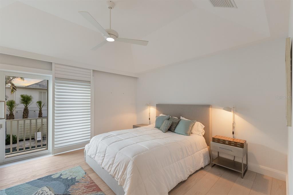 2031 Shore Lane Boca Grande, FL 33921 - Photo 40 of 100 a bedroom with a bed and a mirror