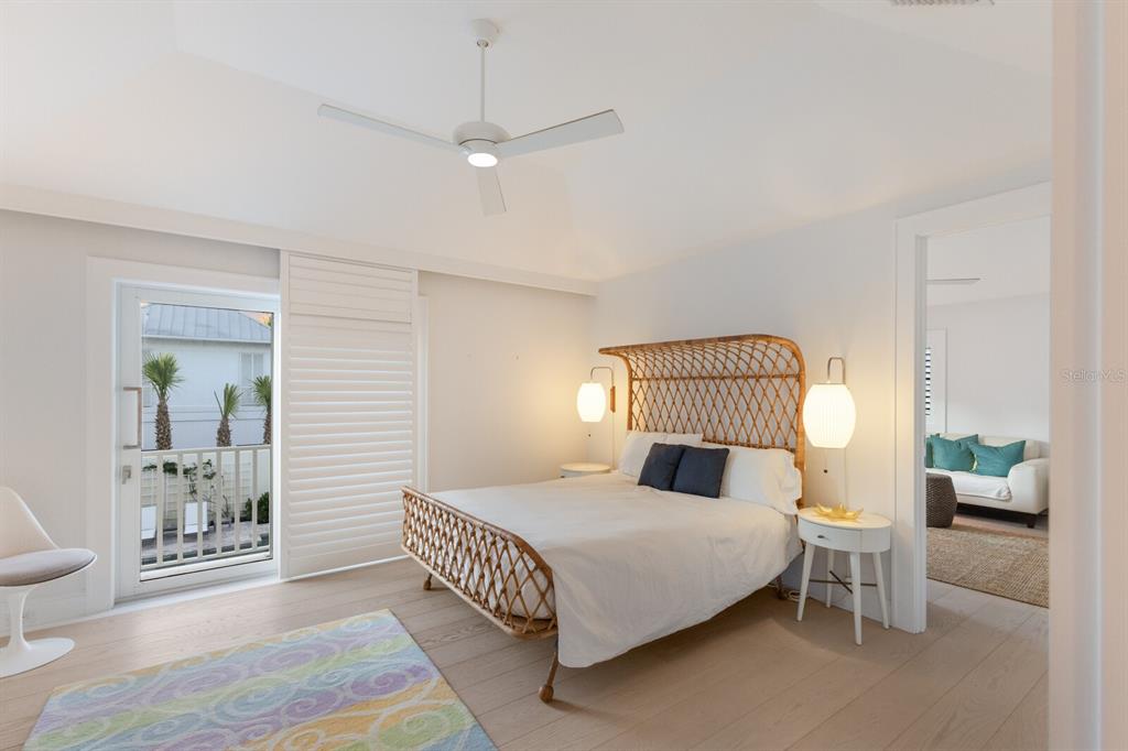 2031 Shore Lane Boca Grande, FL 33921 - Photo 43 of 100 a bedroom with a large bed and a window