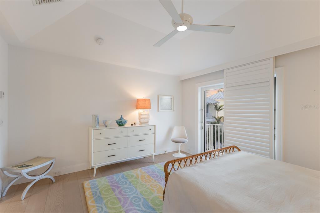 2031 Shore Lane Boca Grande, FL 33921 - Photo 44 of 100 a bedroom with a bed and a cabinets