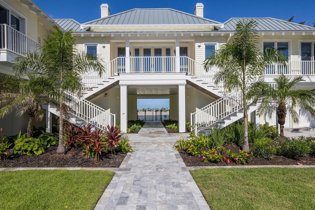 2031 Shore Lane Boca Grande, FL 33921 - Photo 68 of 100 a front view of a house with a garden