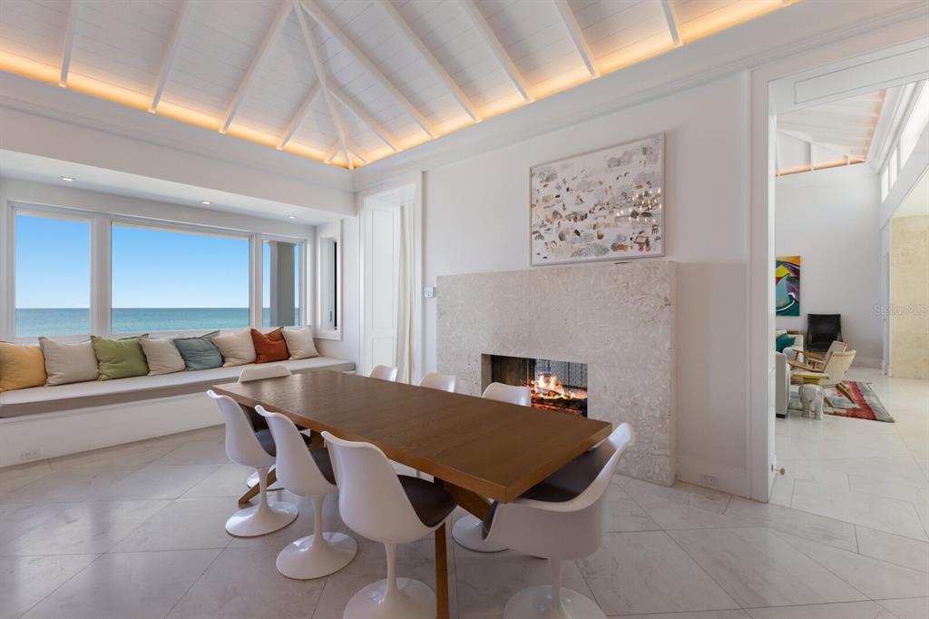 2031 Shore Lane Boca Grande, FL 33921 - Photo 77 of 100 a living room with furniture a rug and a fireplace