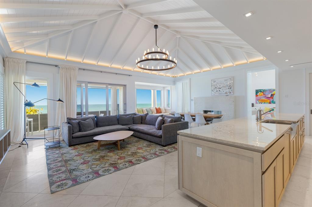 2031 Shore Lane Boca Grande, FL 33921 - Photo 80 of 100 a living room with furniture and a chandelier