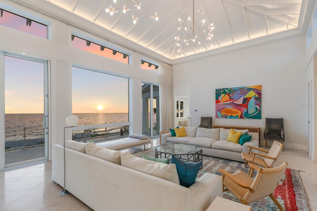 2031 Shore Lane Boca Grande, FL 33921 - Photo 9 of 100 a living room with furniture and a chandelier