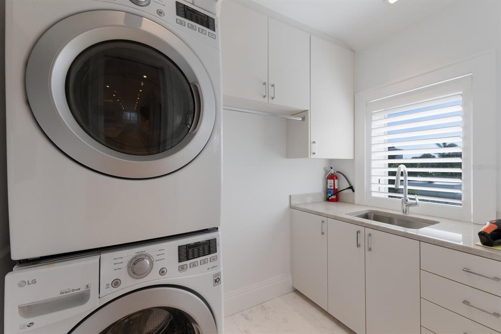 2031 Shore Lane Boca Grande, FL 33921 - Photo 96 of 100 a utility room with sink dryer and washer