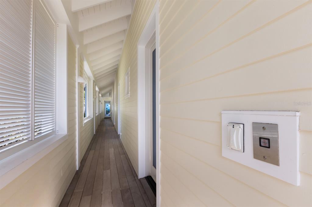 2031 Shore Lane Boca Grande, FL 33921 - Photo 98 of 100 a view of a hallway with wooden floor and staircase