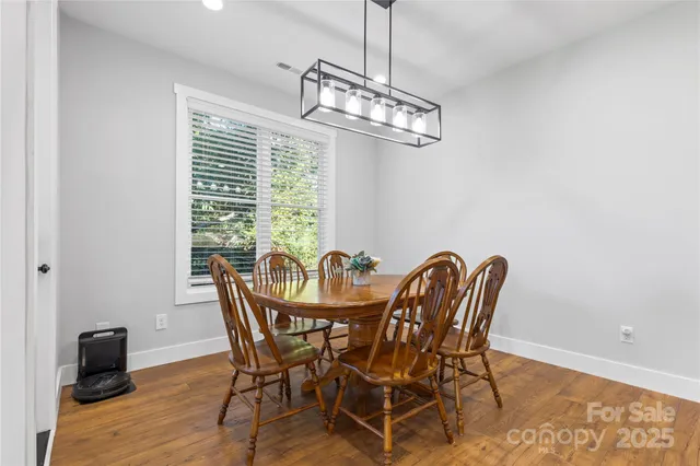a view of a dining room with furniture window and outside view