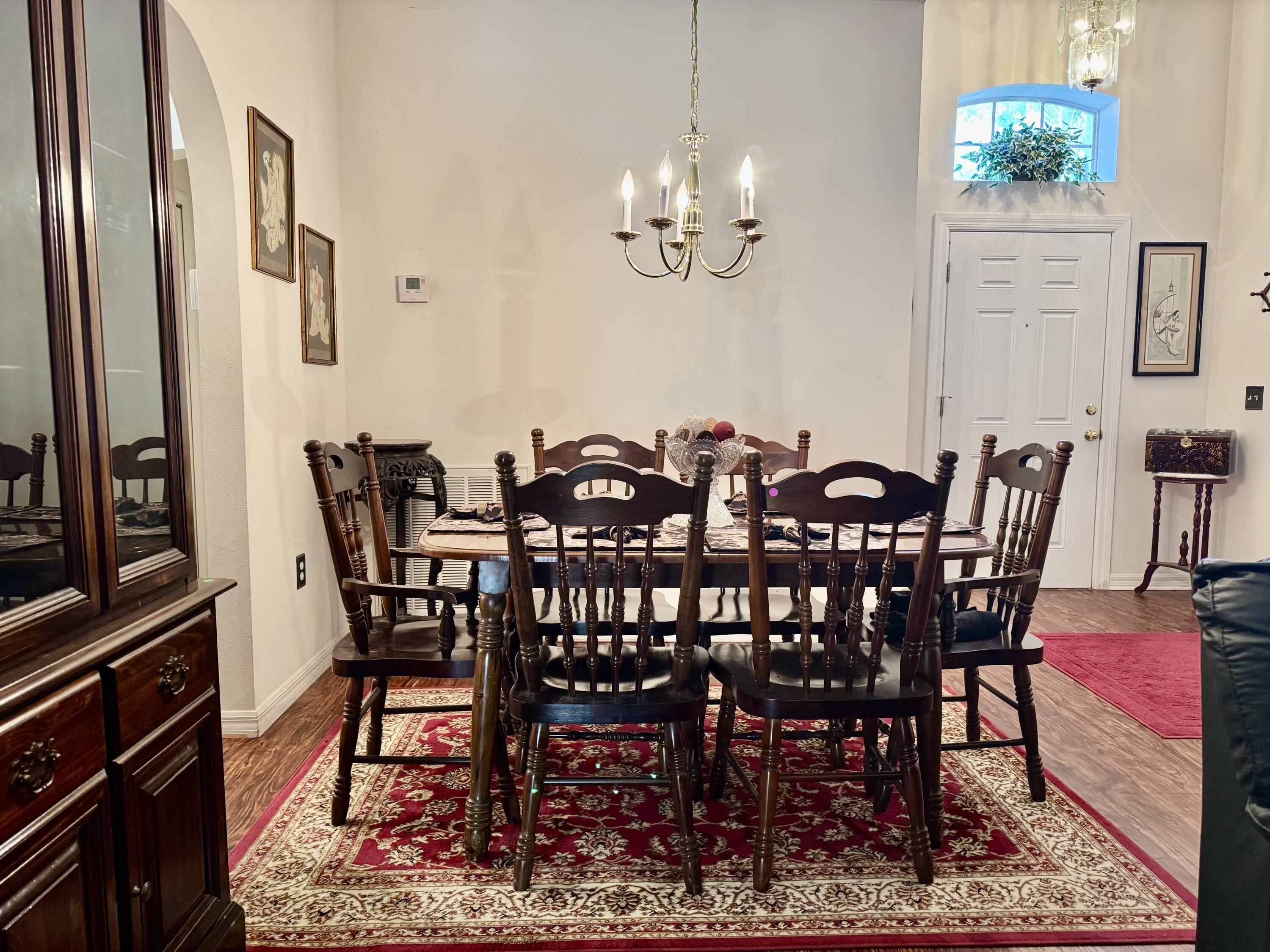 527 Southeast 38th Avenue Okeechobee, FL 34974 - Photo 11 of 30 a view of a dining room with furniture and chandelier