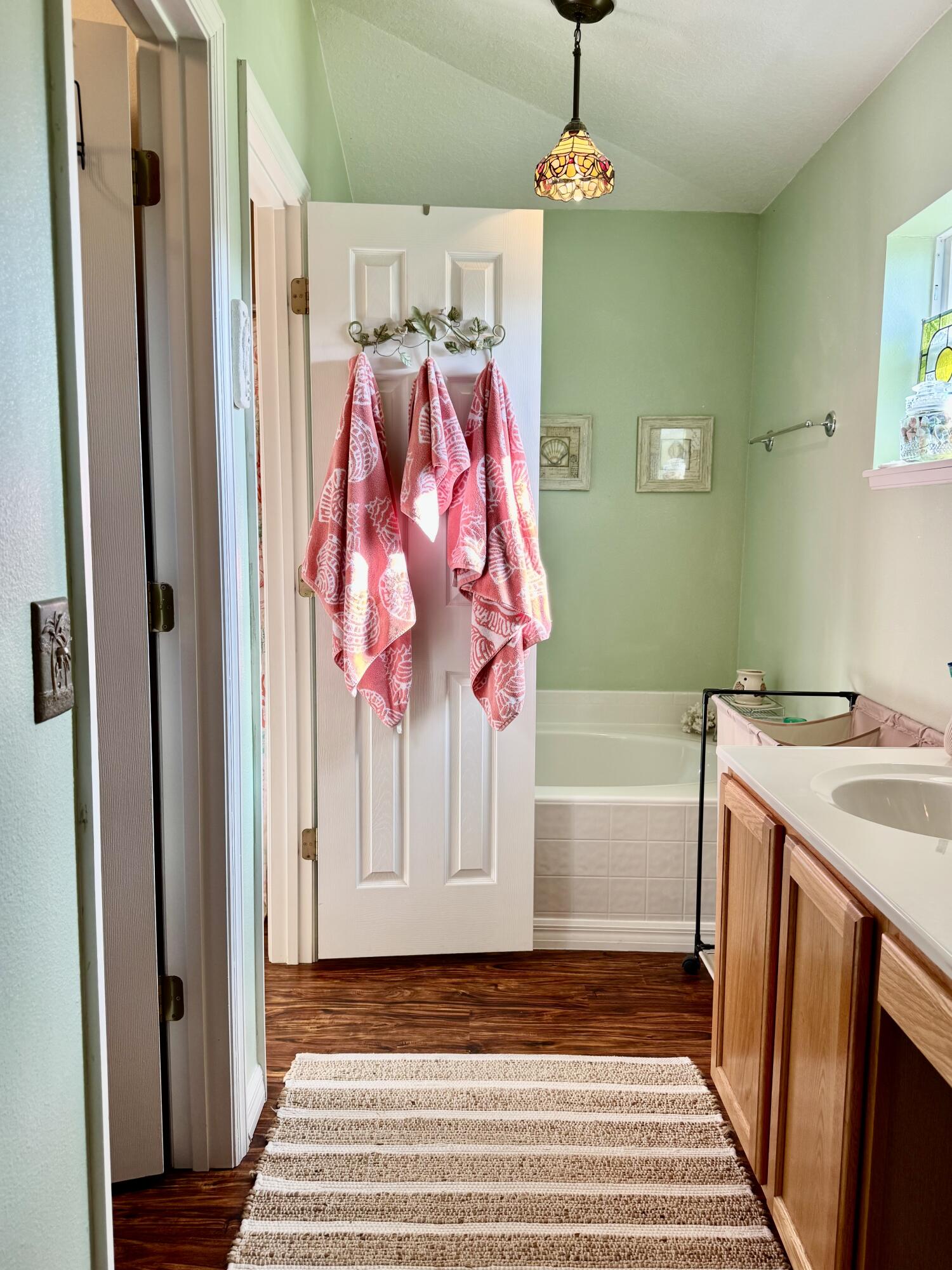 527 Southeast 38th Avenue Okeechobee, FL 34974 - Photo 14 of 30 a bathroom with a sink and a mirror