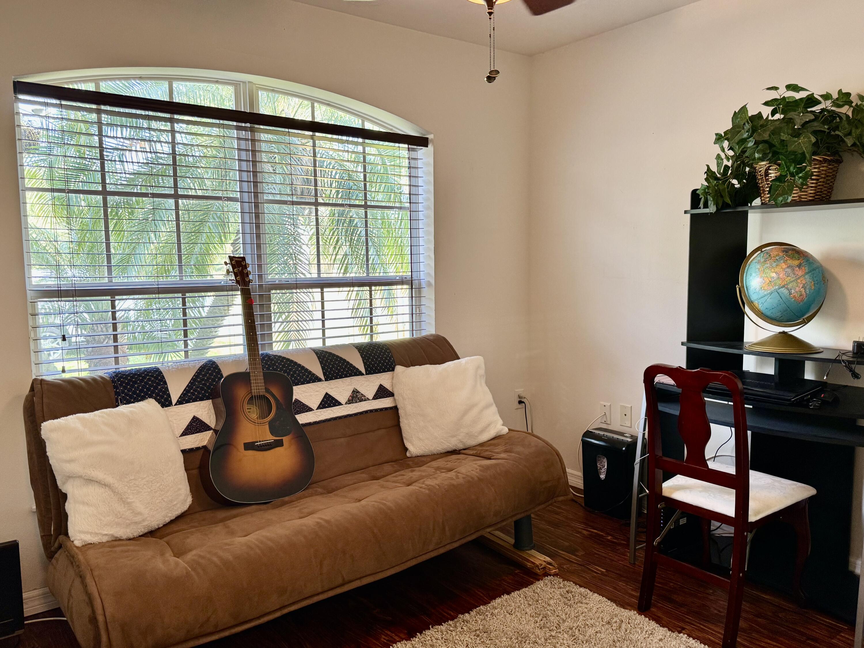 527 Southeast 38th Avenue Okeechobee, FL 34974 - Photo 18 of 30 a living room with furniture and a large window