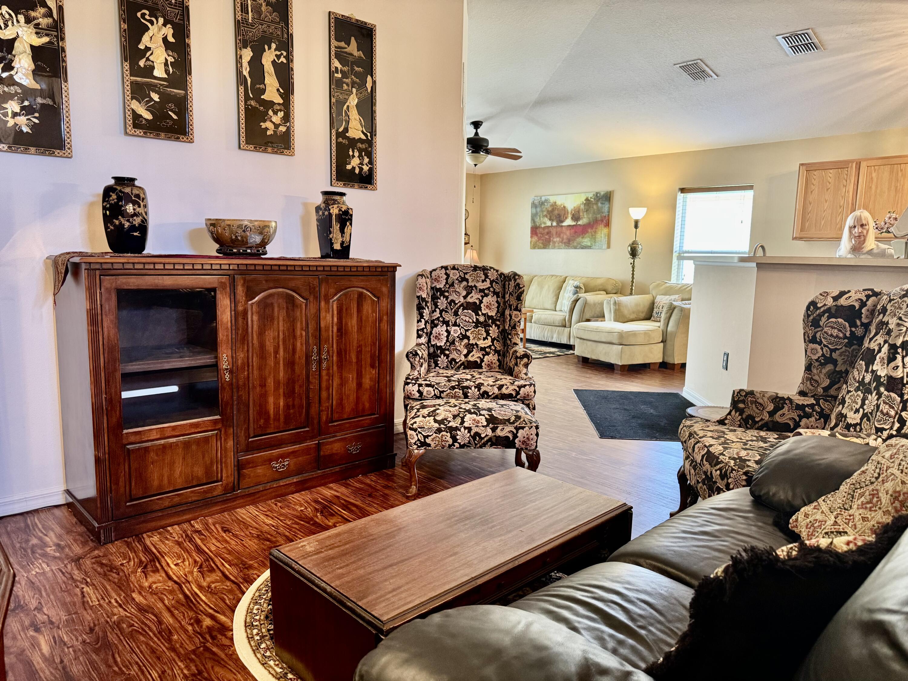 527 Southeast 38th Avenue Okeechobee, FL 34974 - Photo 19 of 30 a bedroom with furniture and wooden floor