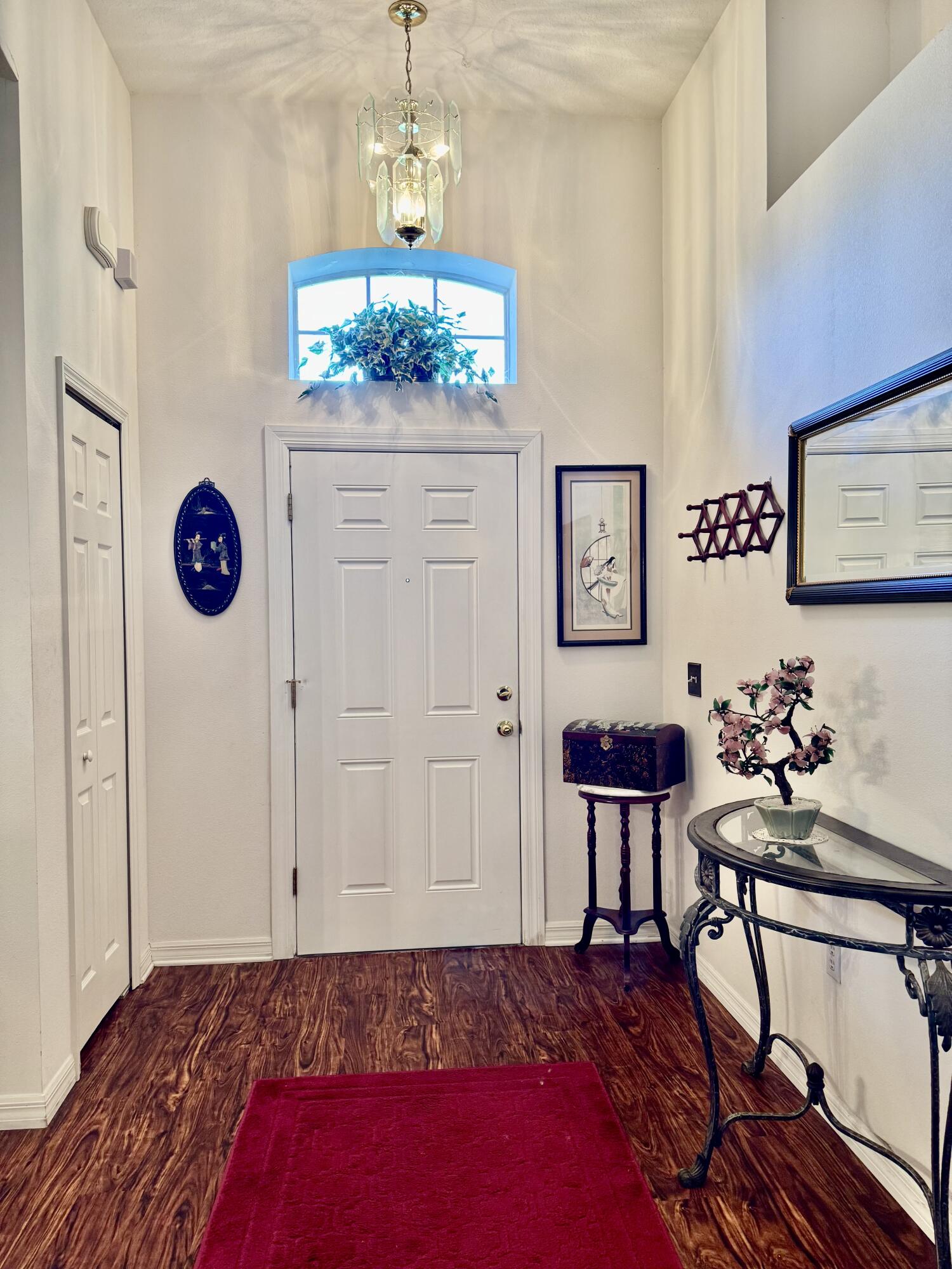 527 Southeast 38th Avenue Okeechobee, FL 34974 - Photo 3 of 30 a bedroom with furniture and a chandelier