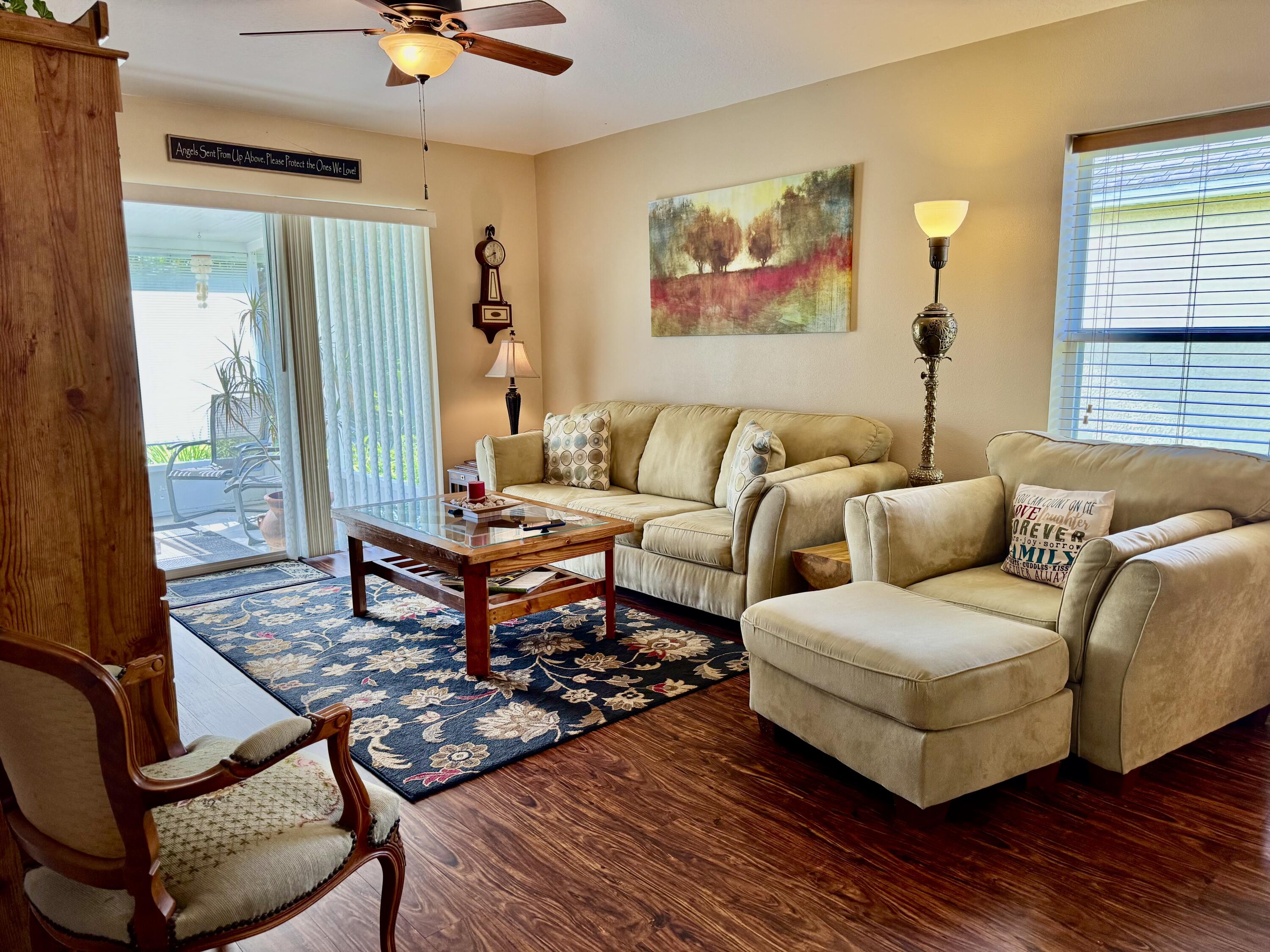 527 Southeast 38th Avenue Okeechobee, FL 34974 - Photo 5 of 30 a living room with furniture a rug and a window