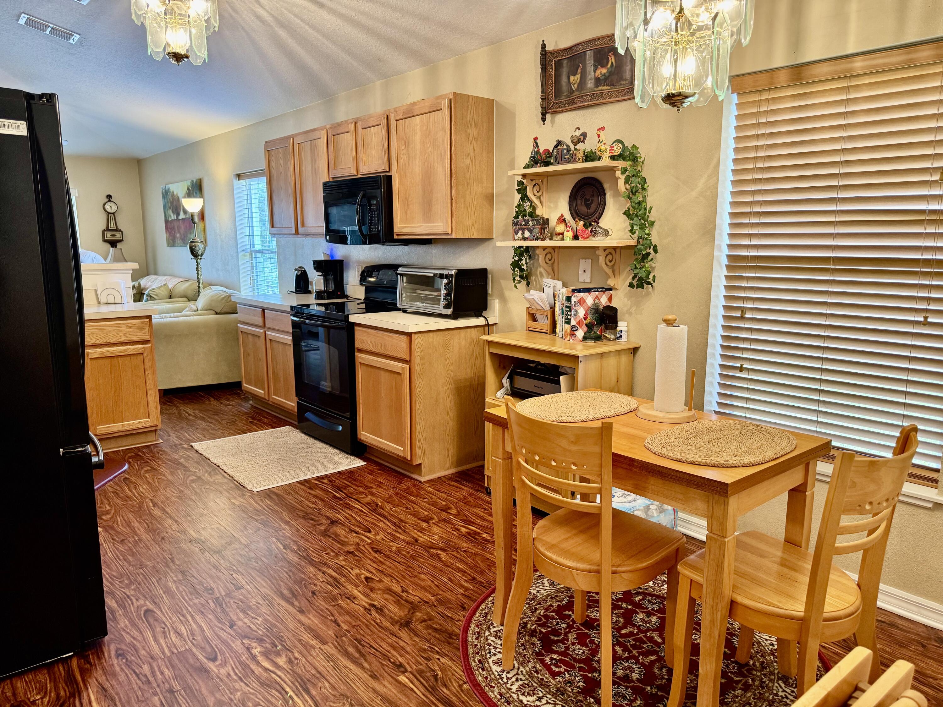 527 Southeast 38th Avenue Okeechobee, FL 34974 - Photo 7 of 30 a kitchen with a sink cabinets and appliances