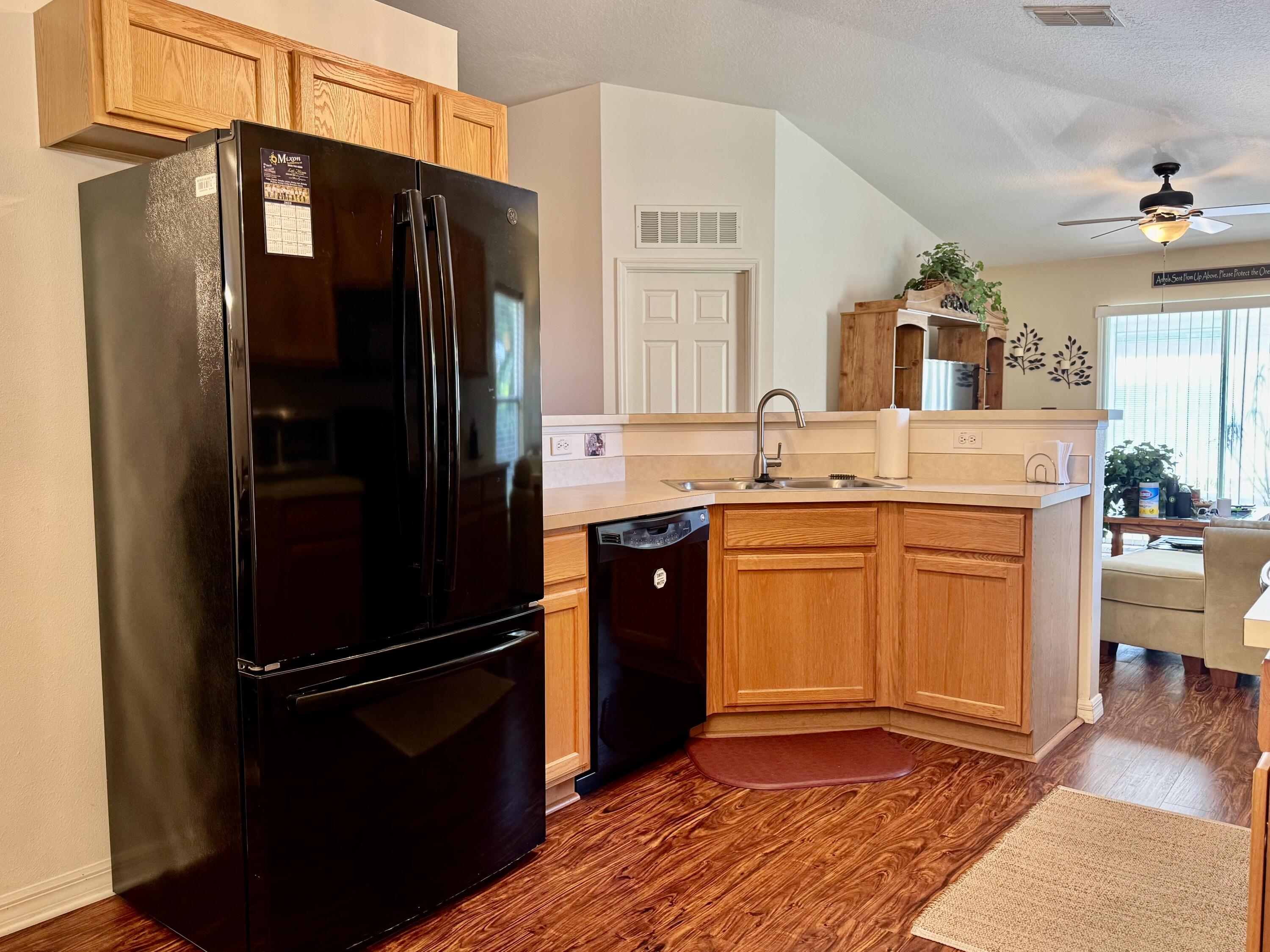 527 Southeast 38th Avenue Okeechobee, FL 34974 - Photo 8 of 30 a kitchen with stainless steel appliances granite countertop a refrigerator a stove and a sink