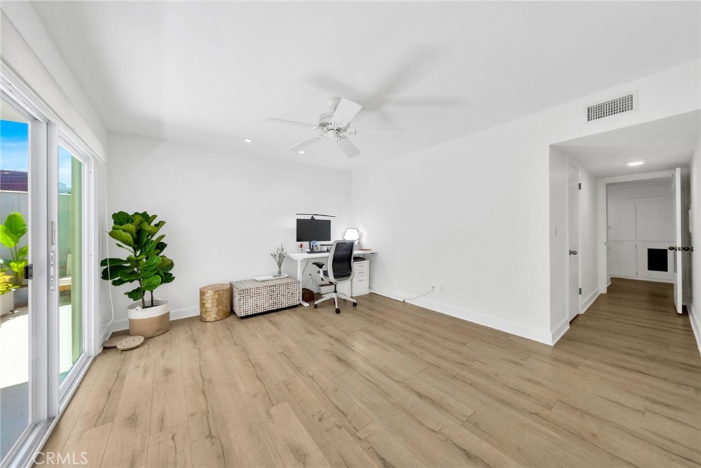 7259 Hillside Avenue, Unit 102 Los Angeles, CA 90046 - Photo 15 of 37 a living room with furniture and a potted plant