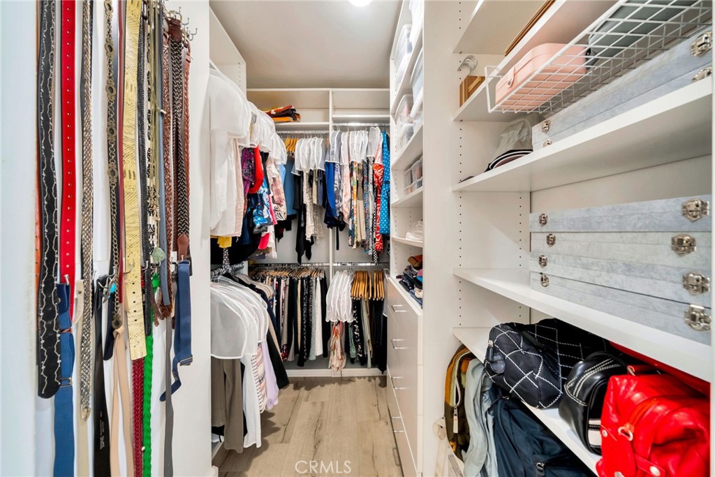 7259 Hillside Avenue, Unit 102 Los Angeles, CA 90046 - Photo 24 of 37 a view of walk in closet with clothes and shoes