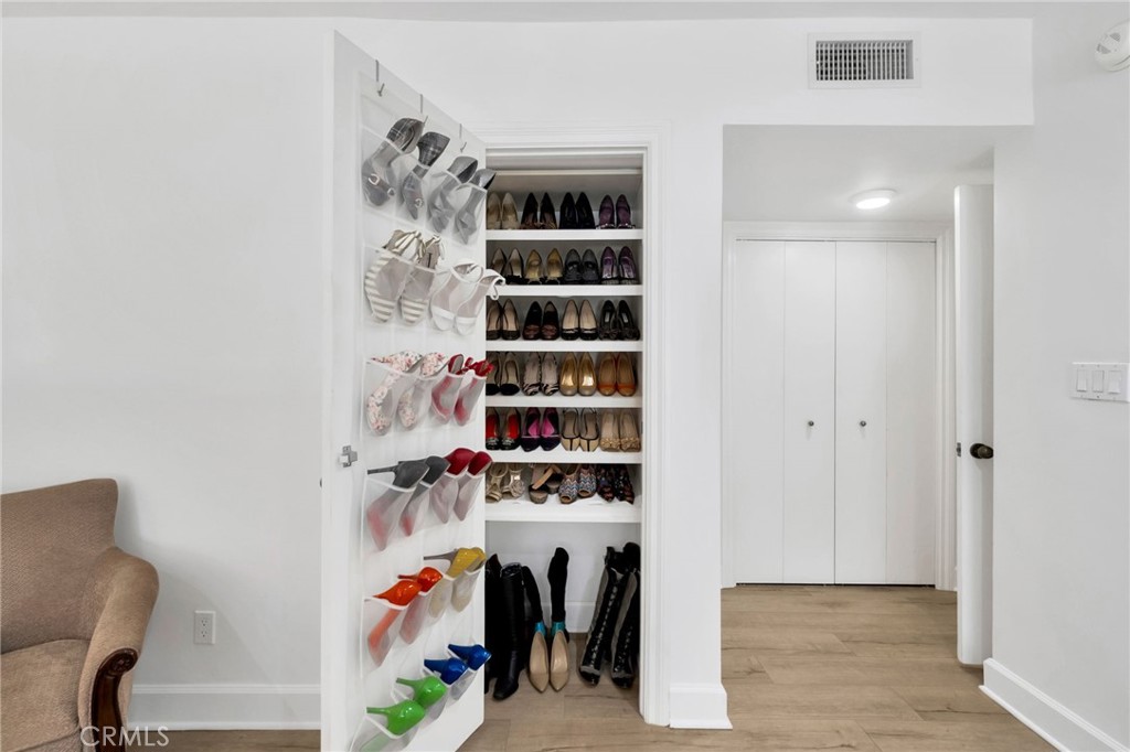 7259 Hillside Avenue, Unit 102 Los Angeles, CA 90046 - Photo 25 of 37 a view of walk in closet with clothes and shoes
