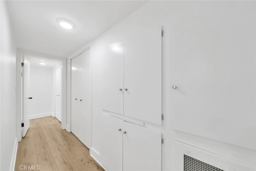 7259 Hillside Avenue, Unit 102 Los Angeles, CA 90046 - Photo 29 of 37 a view of a room with wooden floor and cabinet