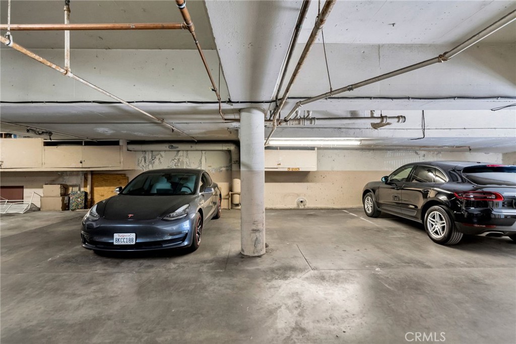 7259 Hillside Avenue, Unit 102 Los Angeles, CA 90046 - Photo 31 of 37 a car parked in a garage