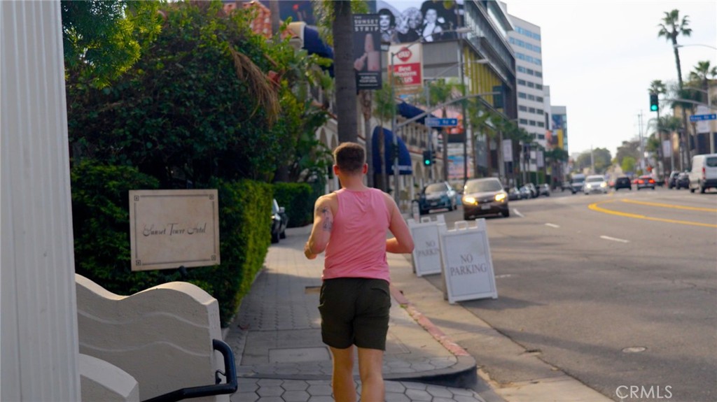 7259 Hillside Avenue, Unit 102 Los Angeles, CA 90046 - Photo 34 of 37 a sign board with a small yard