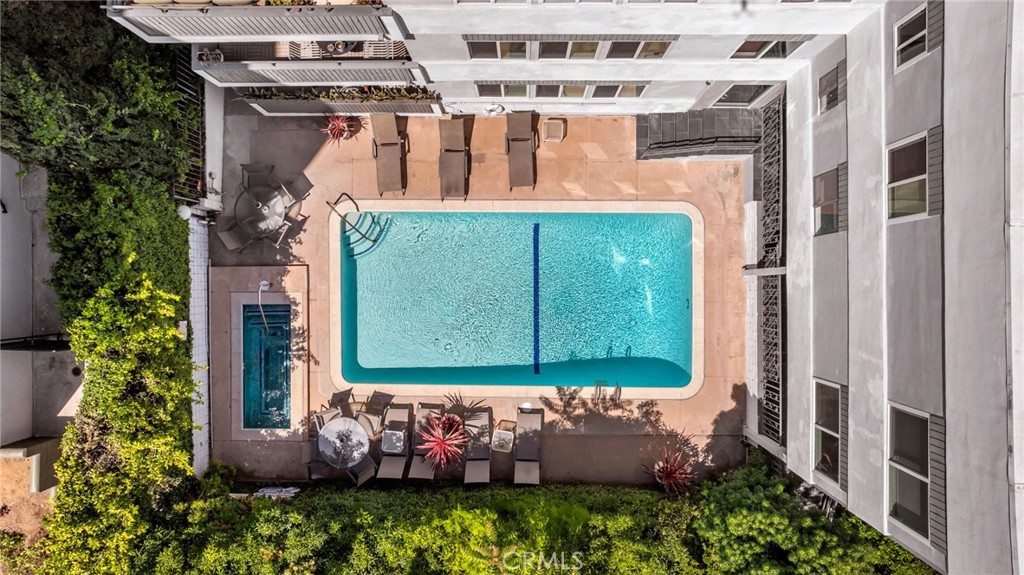 7259 Hillside Avenue, Unit 102 Los Angeles, CA 90046 - Photo 4 of 37 a front view of a house with a yard