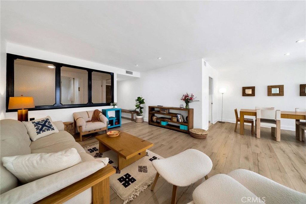 7259 Hillside Avenue, Unit 102 Los Angeles, CA 90046 - Photo 9 of 37 a living room with furniture and wooden floor