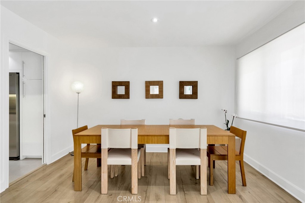 7259 Hillside Avenue, Unit 102 Los Angeles, CA 90046 - Photo 10 of 37 a dining room with furniture and window