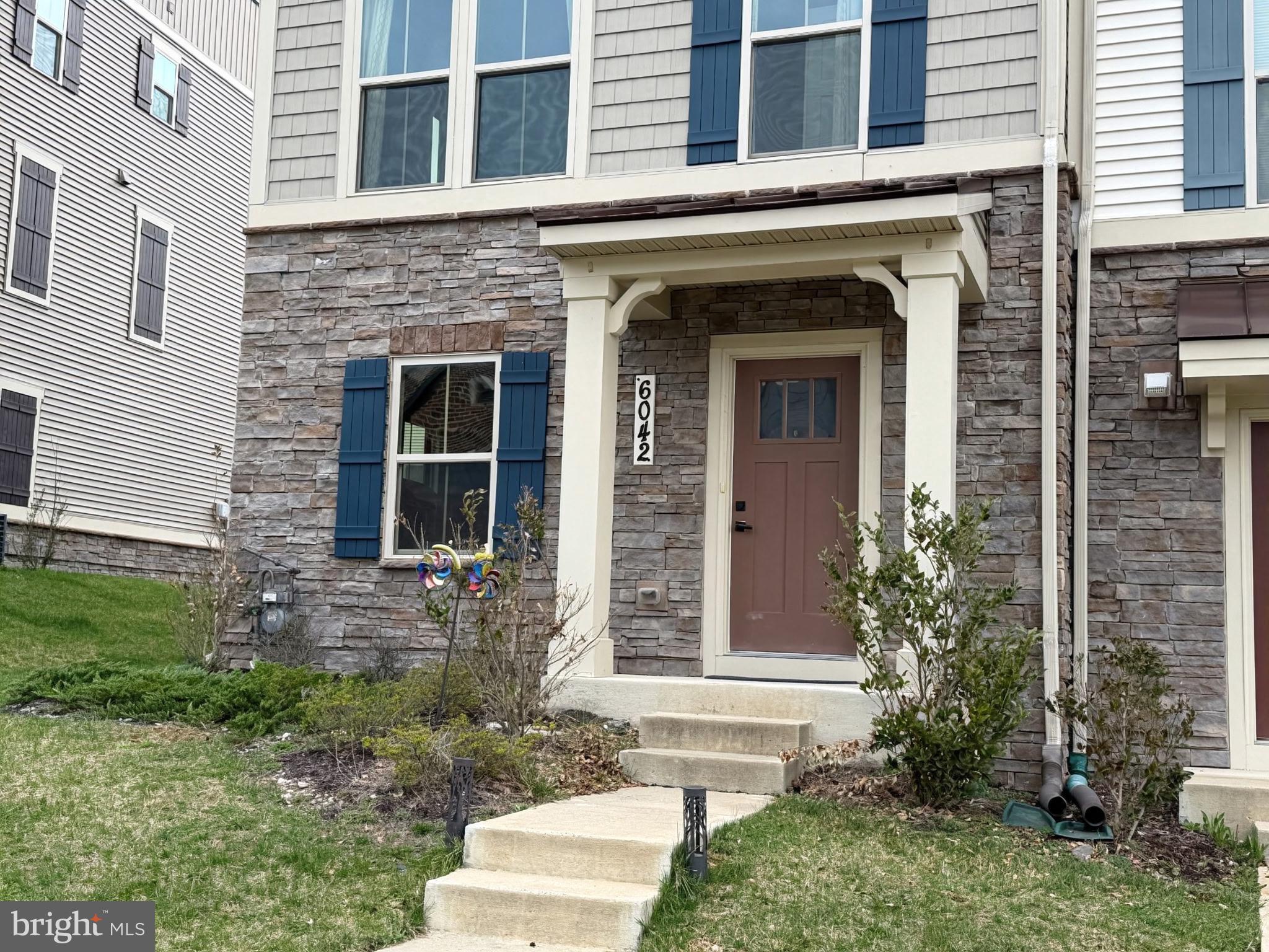 6042 Fallfish Court New Market, MD 21774 - Photo 2 of 77 a front view of a house with garden