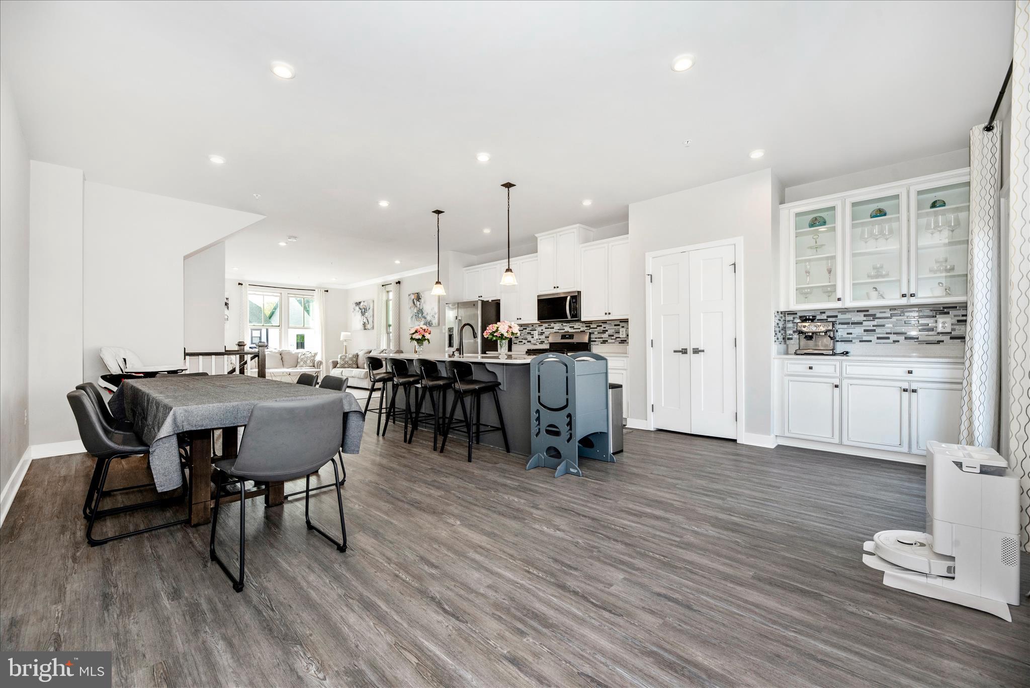 6042 Fallfish Court New Market, MD 21774 - Photo 26 of 77 a view of a dining room with furniture and wooden floor