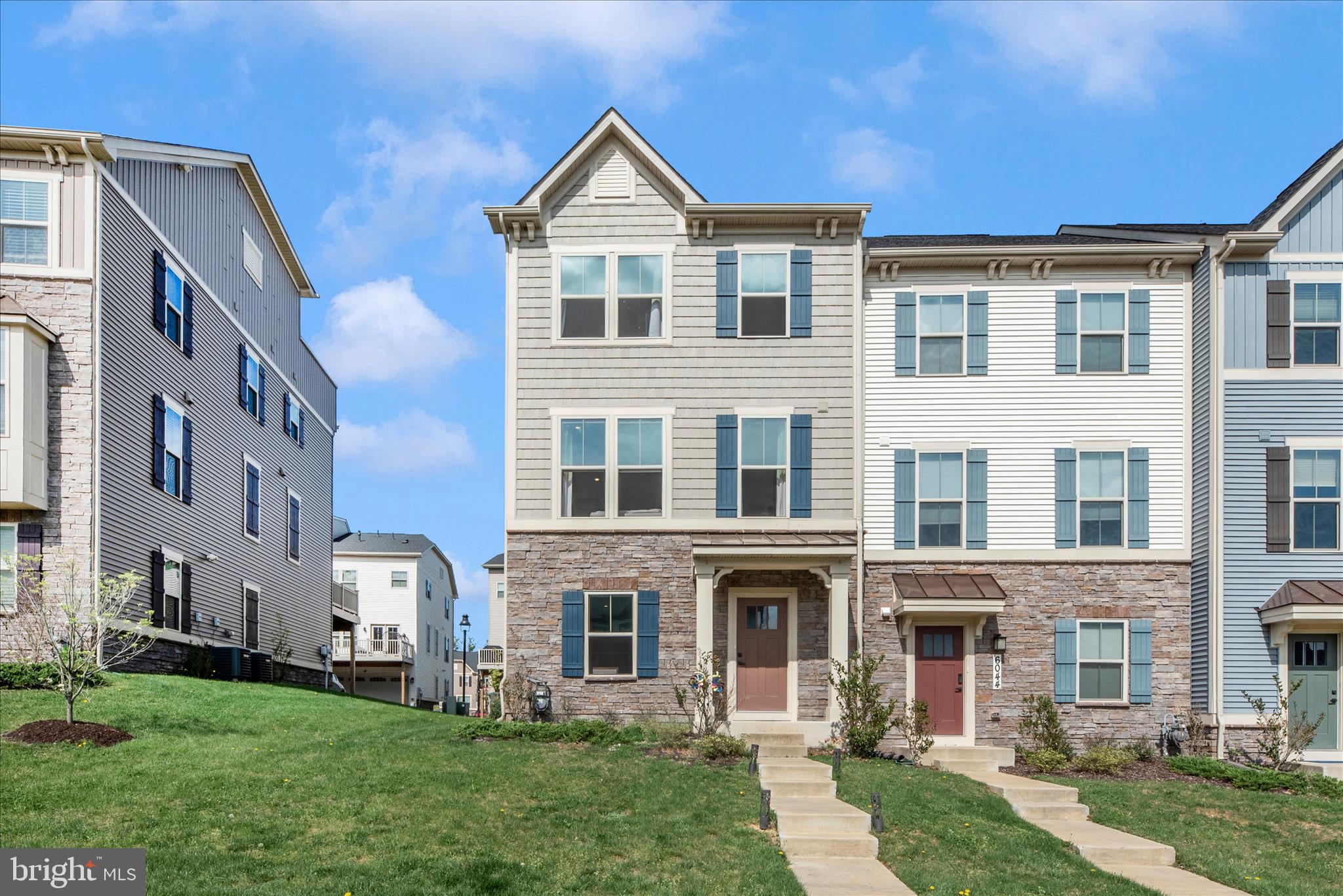 6042 Fallfish Court New Market, MD 21774 - Photo 4 of 77 a front view of a house with a yard