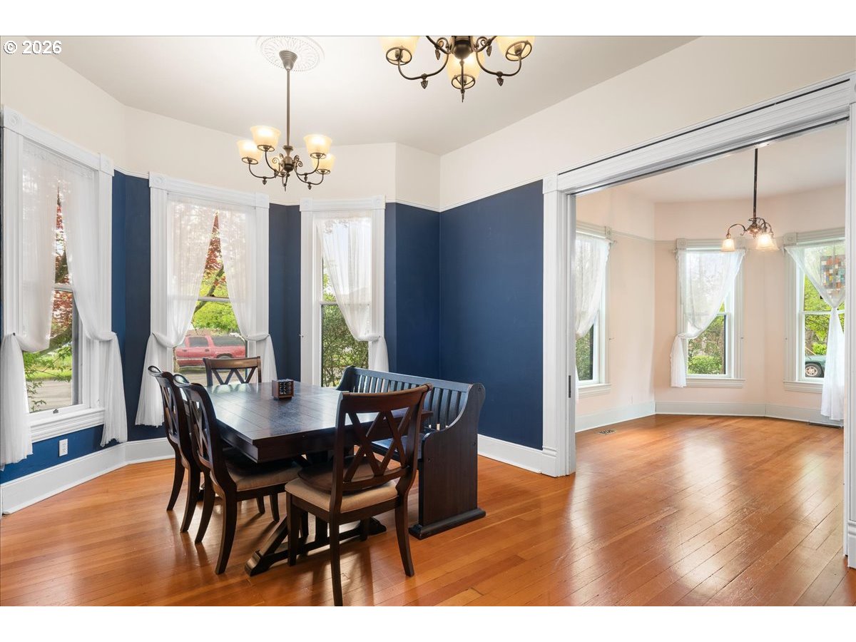 728 6th Avenue Southwest Albany, OR 97321 - Photo 11 of 47 a view of a dining room with furniture window and wooden floor