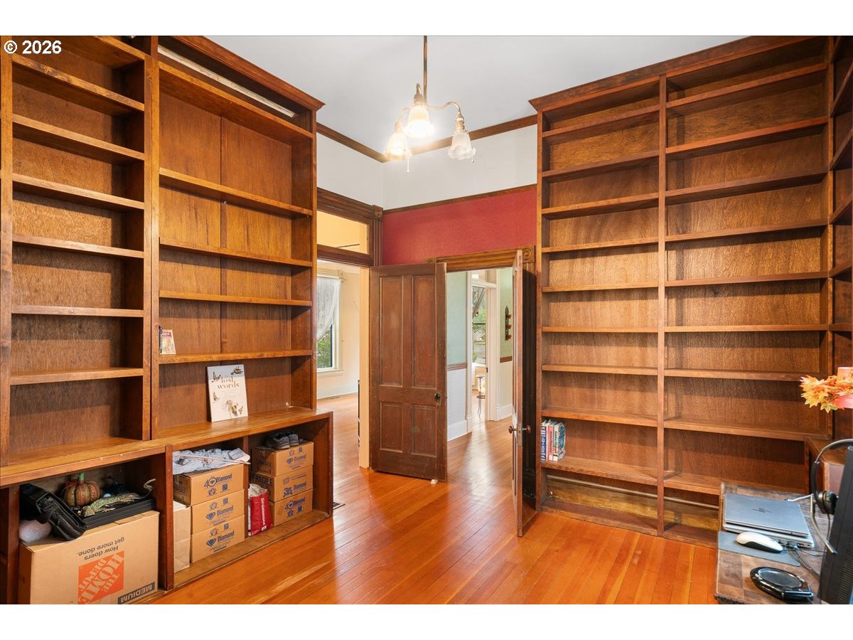 728 6th Avenue Southwest Albany, OR 97321 - Photo 23 of 47 a view of empty room with wooden floor and shelves
