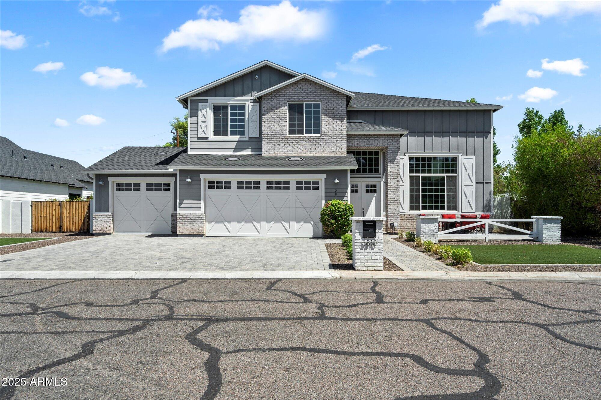 3810 East Devonshire Avenue Phoenix, AZ 85018 - Photo 1 of 34 a front view of a house with a yard and potted plants